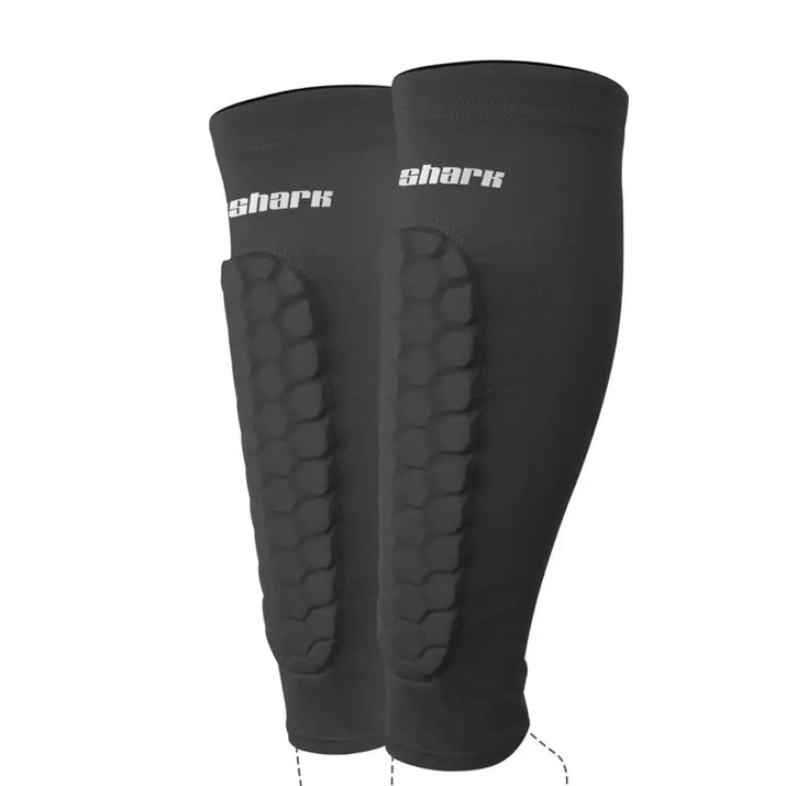 Black pro sports shin guards for kids with padded protection and shark logo for impact resistance